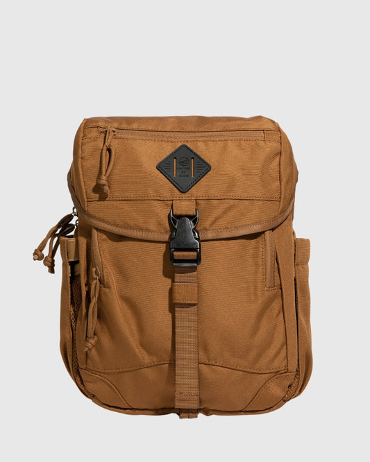 Camel (R)evolution™ 9L Sidekick (Front): Tan canvas bag with black buckle strap, front pocket, side mesh pocket