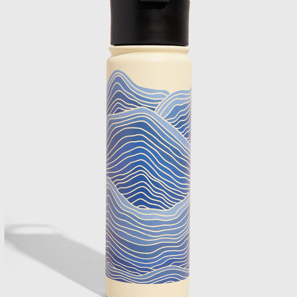 Eggshell - Waves Bottle - 22 Oz. Insulated Stainless Steel (Front): Tall cream bottle with blue wave pattern and black flip-top lid