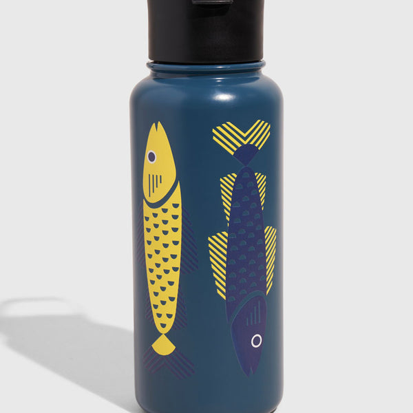 Rainstorm - Fish Bottle - 23 Oz. Insulated Stainless Steel (Angle): Teal steel bottle with yellow and navy geometric fish illustrations, black lid