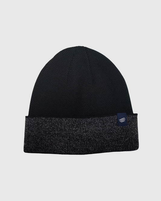 Black The Essential Merino Marled Beanie (Front): Black knit beanie with marled gray cuffed brim and small navy logo patch
