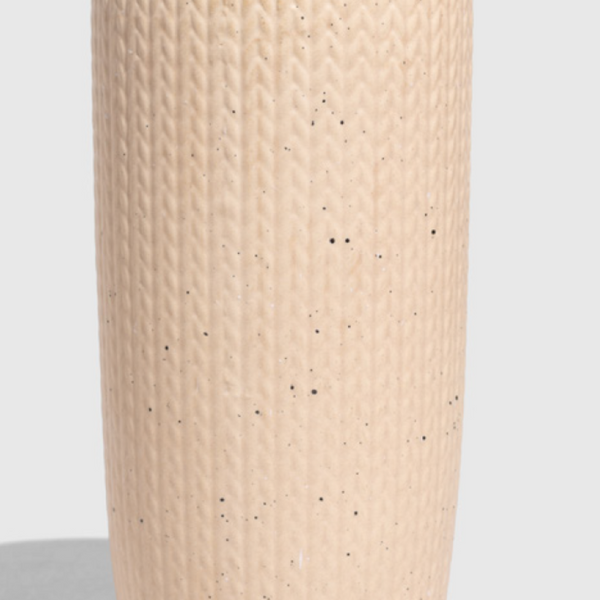 Shortbread-Knit 10 oz. Insulated Stoneware Travel Mug (Front): Cream speckled cylindrical mug with knit texture embossing and black lid clip