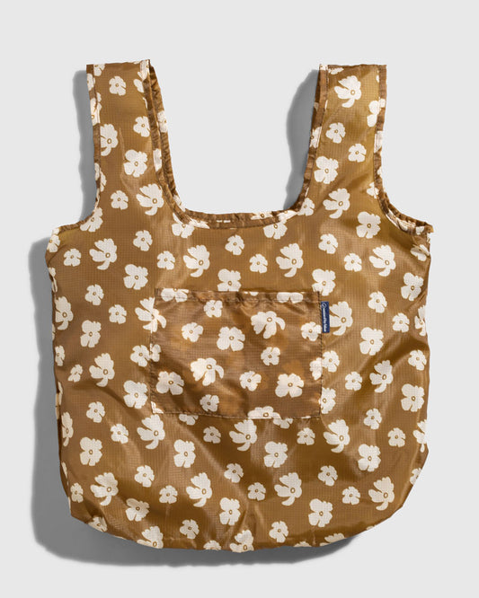 Smoky Ochre The Packable Tote (Flat-lay): Golden brown tote with white floral print, two straps, front pocket