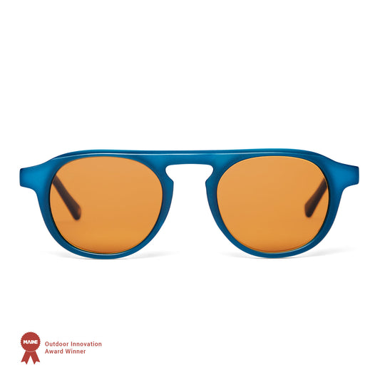 Blue-framed sunglasses with orange lenses on a white background, featuring an award badge.