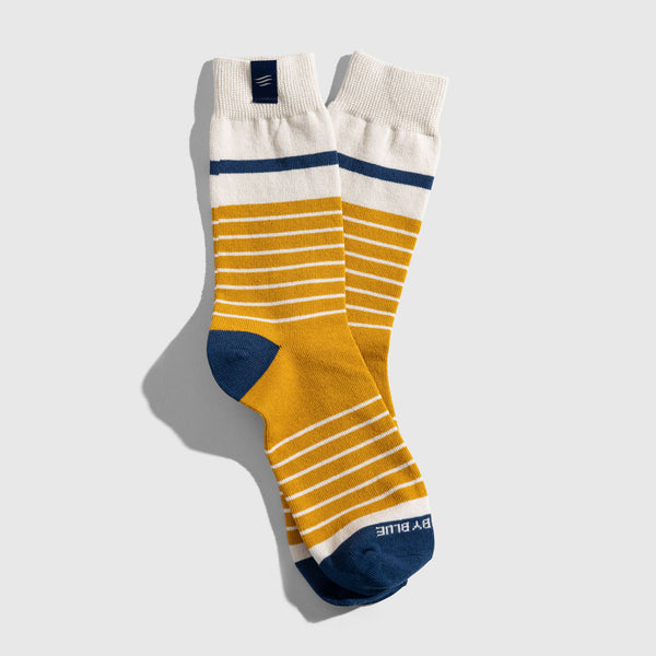 Wood Thrush IMPACT COLLECTION - Hemp Blend Socks (Flat-lay): Mustard yellow striped crew socks with white cuff and navy heel and toe