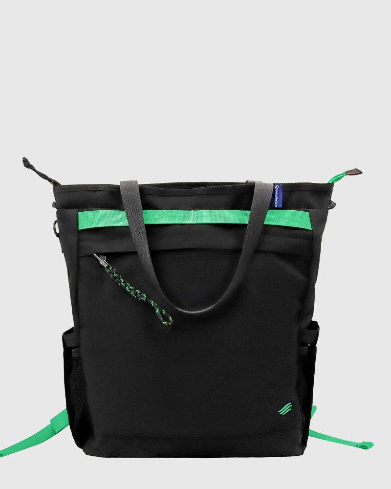 Black Multi (R)evolution™ 25L Convertible Carryall (Back): Black tote with gray handles, green webbing stripe, and zipper pull