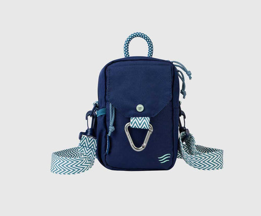 Navy (R)evolution™ Daily Cross Body (Front): Navy crossbody bag with chevron strap, carabiner clip, and rope handle