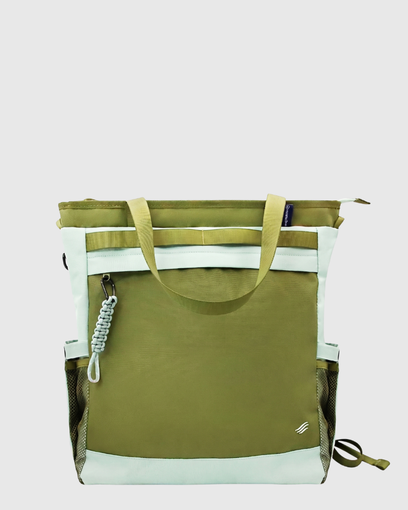 Green Multi (R)evolution™ 25L Convertible Carryall (Front): Olive green tote with mint accents, paracord clip, and mesh side pockets