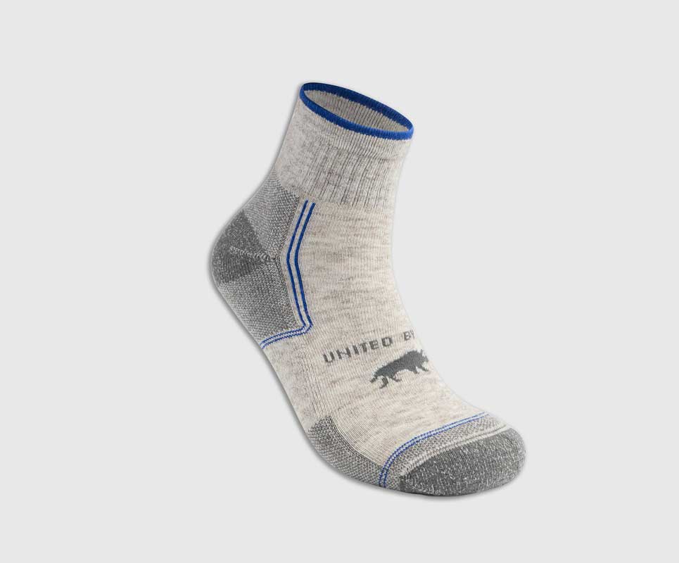 Grey Bison Trail Quarter Sock (Angle): Light grey quarter sock with blue cuff trim, grey heel and toe reinforcement, bison logo on side