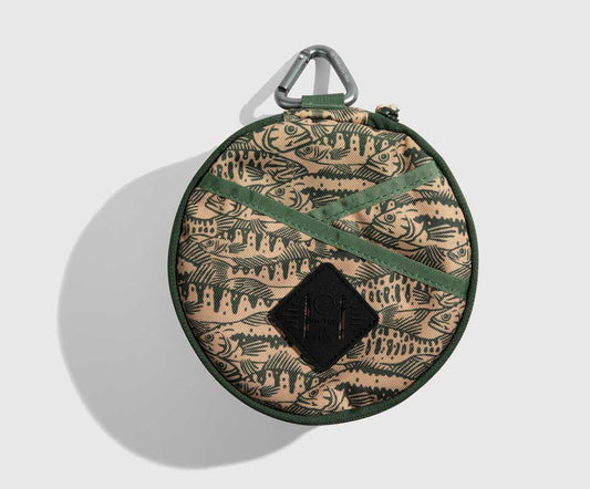 Cortado The Meal Kit (Single) (Front): Round tan pouch with fish print, green straps, carabiner clip top