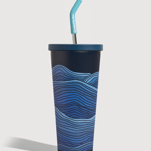 Lake- Waves 24 oz Insulated Steel Straw Tumbler (Angle): Dark navy tumbler with blue wave print, teal lid and bent straw