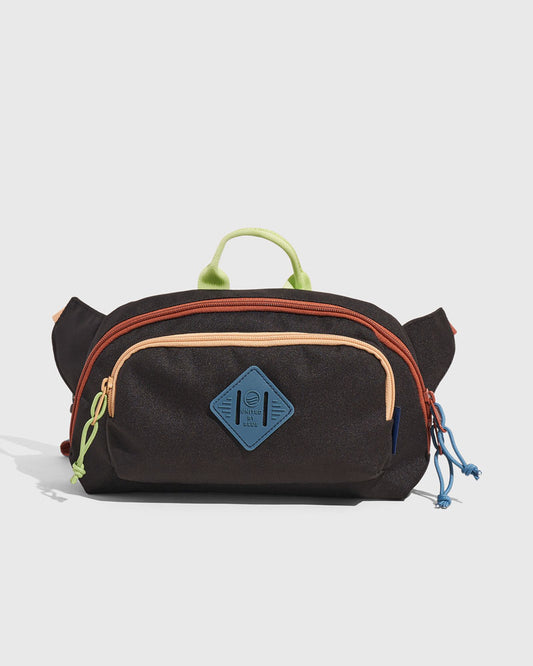 Black Multi (R)evolution™ 3L Utility Fanny Pack (Front): Dark brown fanny pack with colorful zippers, rope pulls, and blue logo patch