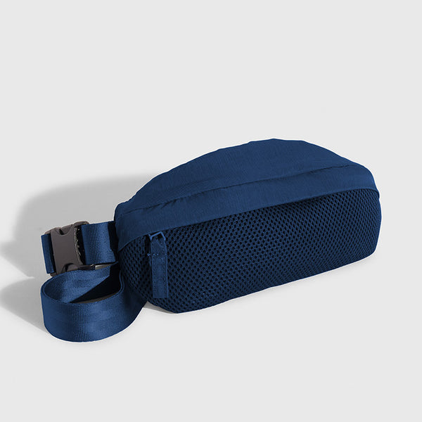 Blueberry (Re)active™ 1L Fanny Pack (Angle): Navy blue fanny pack with mesh front panel and buckle strap