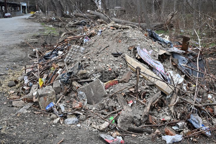 Pile of illegally dumped construction debris and trash at the Pennypack Park site