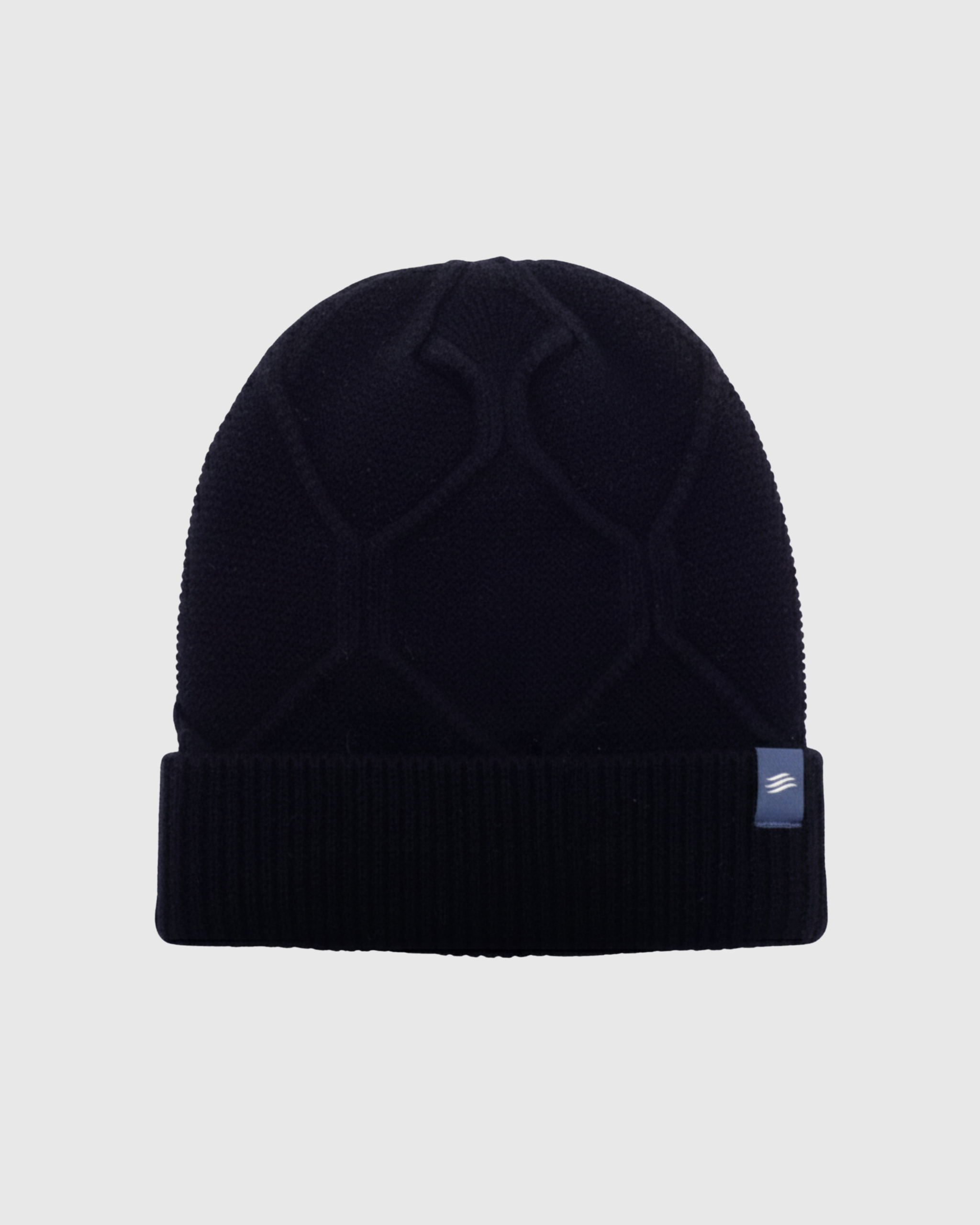 Black knit beanie with a brand logo on a light gray background