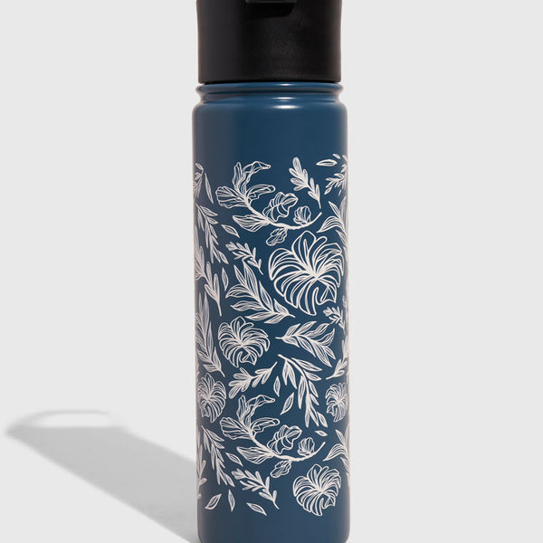 Navy blue water bottle with white leaf pattern on a light gray background