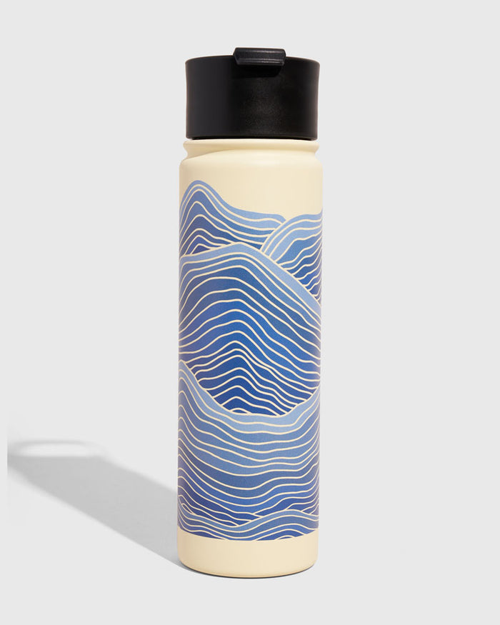 Eggshell - Waves Bottle - 22 Oz. Insulated Stainless Steel (Front): Tall cream bottle with blue wave pattern and black flip-top lid