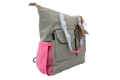 Lt Gray (R)evolution 27L Utility Convertible Tote (Angle): side view showing pink mesh water bottle pocket and front flap organizer pockets