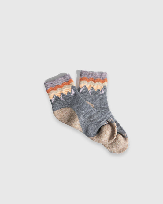 Grey Heather Mountainscape Merino Wool - Quarter Sock - New Color (Flat-lay): Grey quarter socks with orange and cream mountain knit band, tan toe