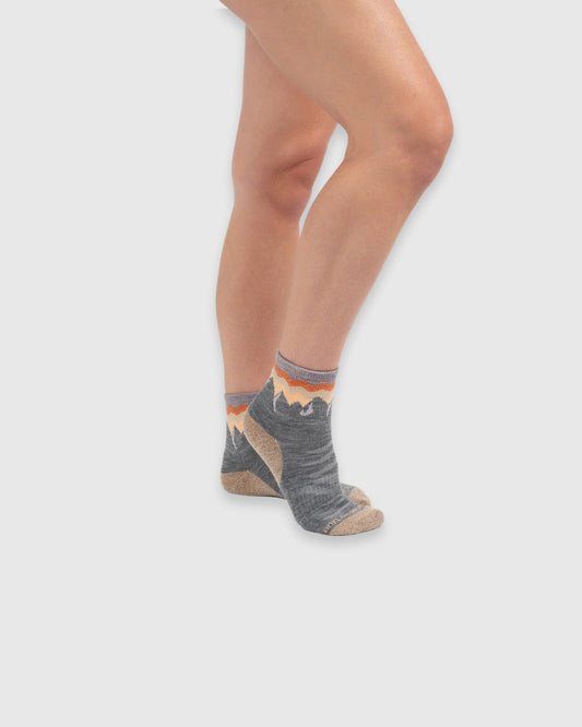 Merino Wool - Quarter Sock - New Color (In-use): Grey mountain-pattern merino quarter socks worn on feet, side view