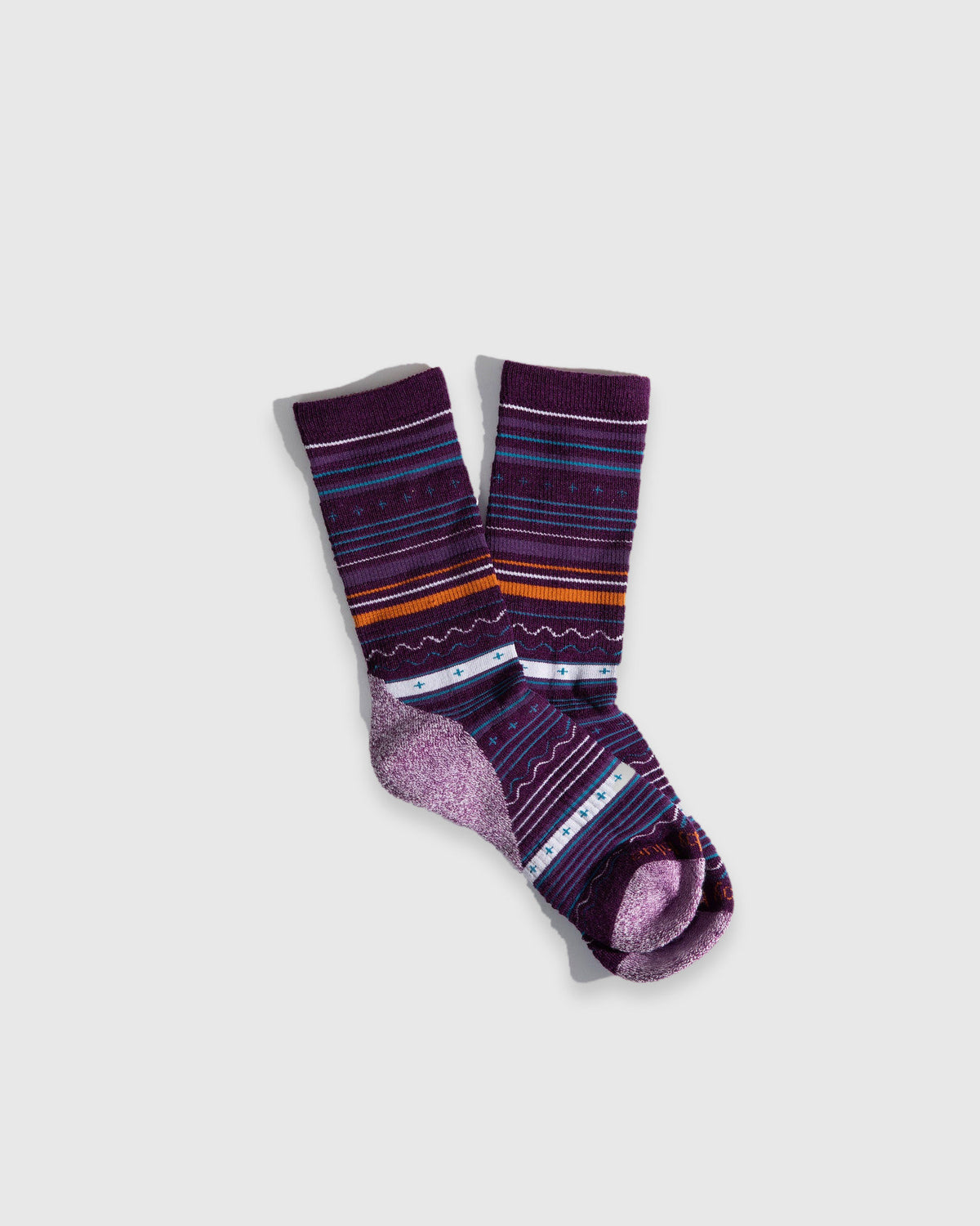 Magenta Fair Isle Merino Wool Trail Crew Sock - New Color (Flat-lay): Purple crew socks with teal, orange and white fair isle stripes, lilac heel