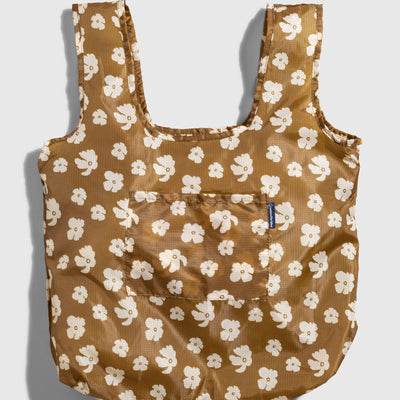 Smoky Ochre The Packable Tote (Flat-lay): Golden brown tote with white floral print, two straps, front pocket