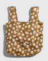 Smoky Ochre The Packable Tote (Flat-lay): Golden brown tote with white floral print, two straps, front pocket