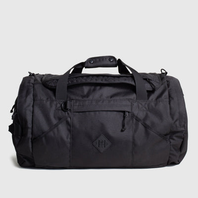 Black (R)evolution™ 55L Carry-On Duffle (Front): Black duffel bag with top handles, front zip pocket, and diamond logo patch