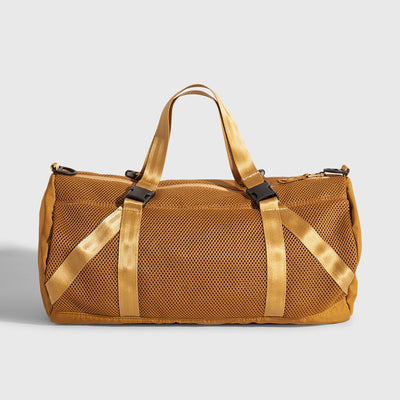 Smoky Orchre (Re)active™ 16L Mini Duffle (Front): Golden tan mesh duffle bag with nylon straps and black buckles