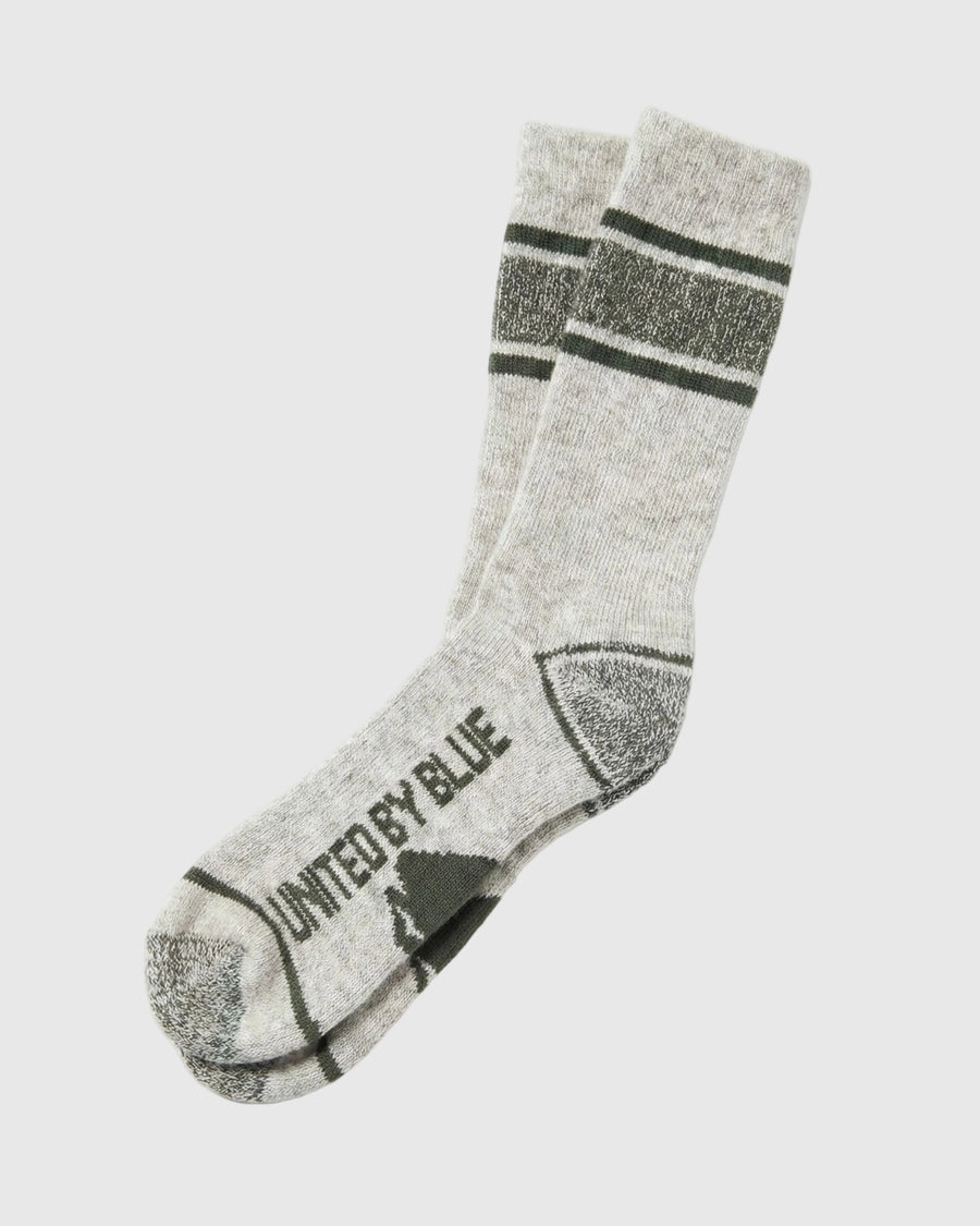 Wild Green Ultimate Bison Boot Sock - Imperfect Packaging (Angle): Light gray crew sock with dark green stripes, reinforced heel and toe