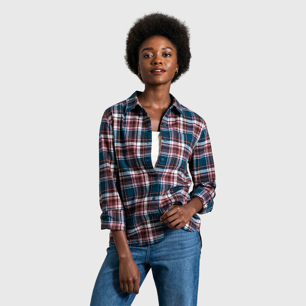Legion Blue The Responsible Flannel - Impact Collection (In-use): Woman wearing open teal and pink plaid flannel shirt over white top