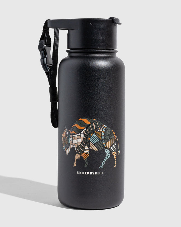 Black - Ink Bottle - 23 Oz. Insulated Stainless Steel (Angle): Matte black bottle with colorful patchwork bison graphic and carrying strap