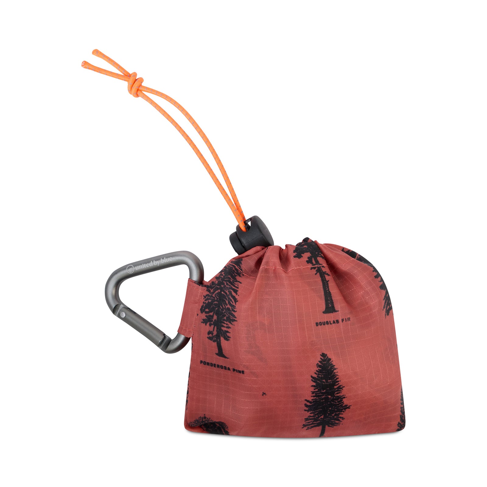 Clay The Packable Tote (Packed): Rust-orange tree-print tote folded into stuff sack with silver carabiner clip and orange bungee toggle