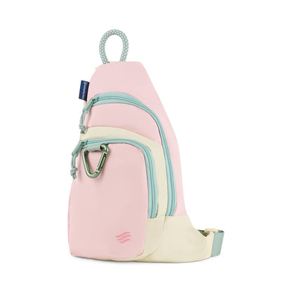Pink Multi (R)evolution Sling Pack (Front): Pink and cream sling pack with mint zippers, green carabiner, and rope handle loop