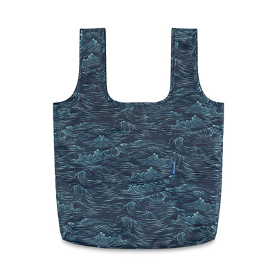 Waves The Packable Tote (Front): Navy tote with teal wave print, two straps, front pocket