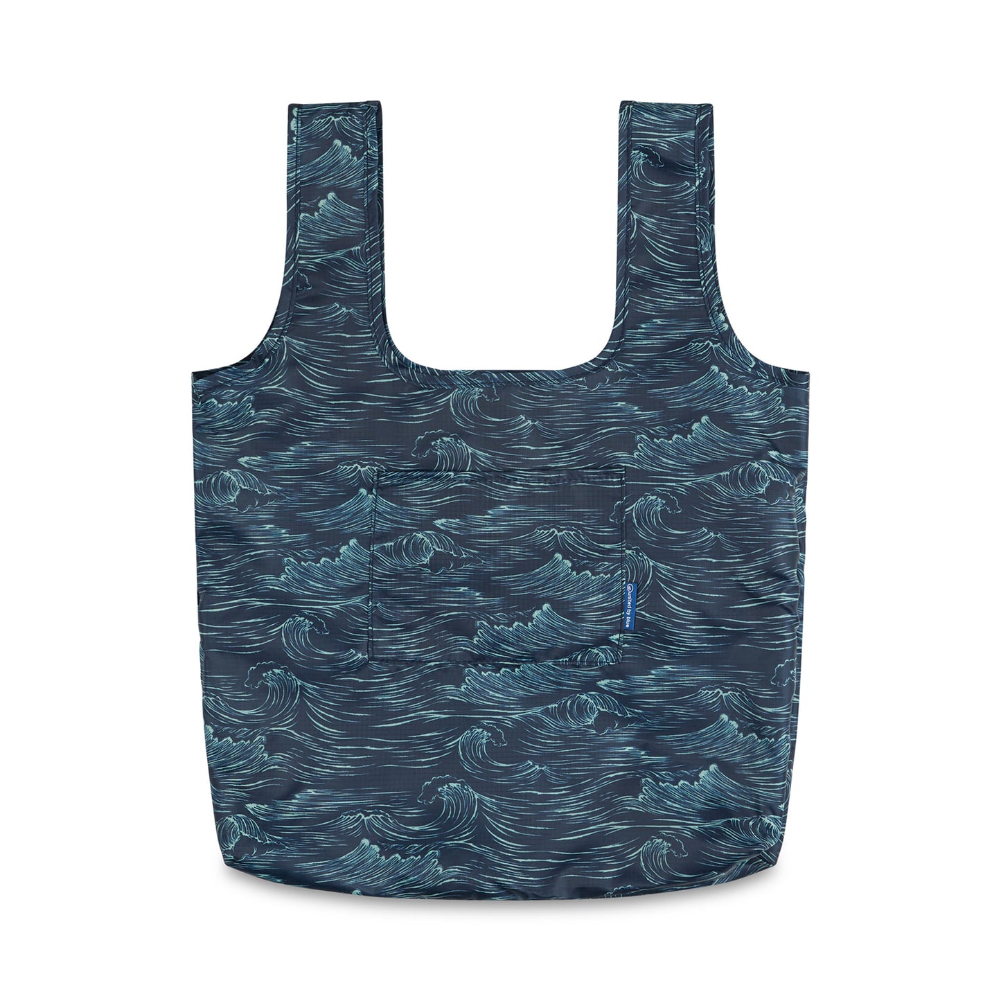 Waves The Packable Tote (Front): Navy packable tote with white ocean wave print, two long straps, and front patch pocket