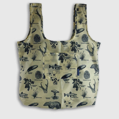 Grizzly The Packable Tote (Front): Tan tote with navy wilderness print, two straps, front pocket