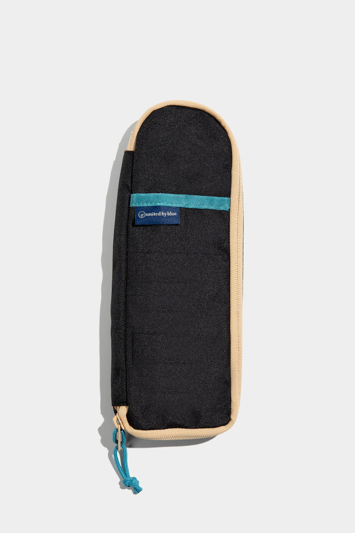 Black The Utensil Pack - Perfect for Packed Lunches (Front): Black rectangular case with tan trim, teal zipper pull and brand label