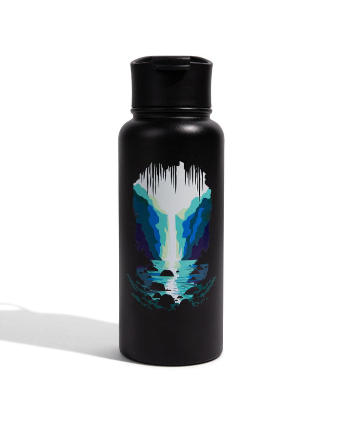 Rocky Waterfall Bottle - 23 Oz. Insulated Stainless Steel (Front): Matte black bottle with circular waterfall cave scene in blue tones