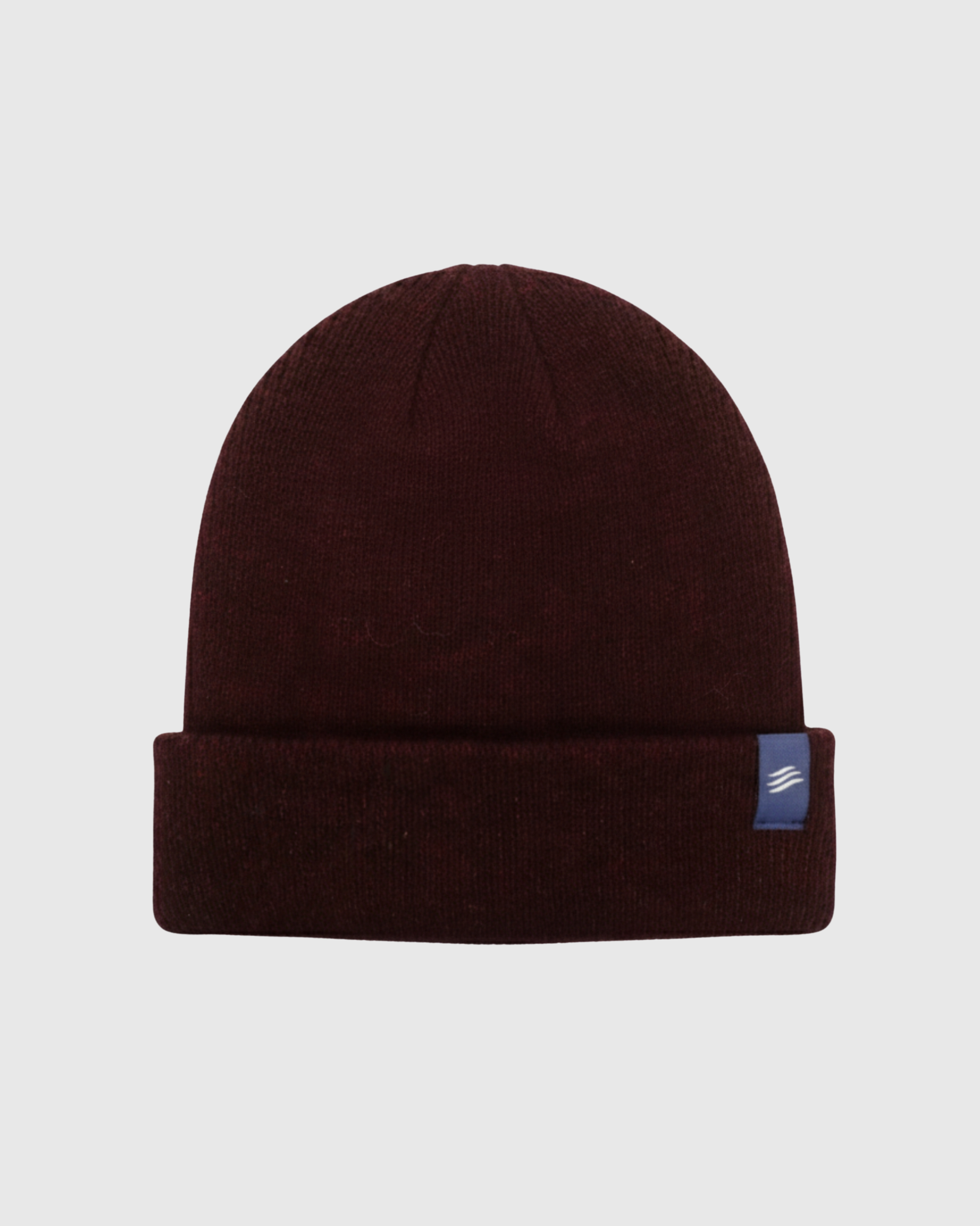 Brown beanie with a small logo on a light gray background