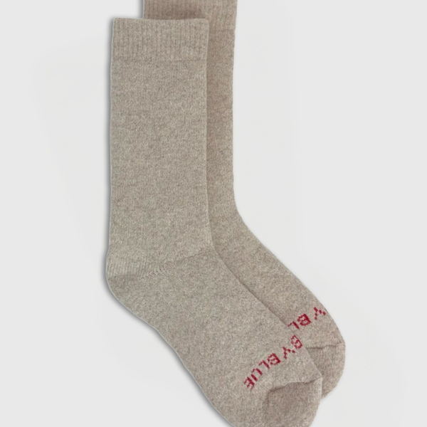 Oatmeal Yak Wool - Ultimate Full Cushion Boot Sock (Flat-lay): Pair of heathered beige crew socks with red brand text on toe