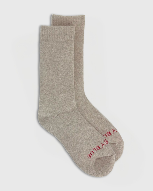 Oatmeal Yak Wool - Ultimate Full Cushion Boot Sock (Flat-lay): Pair of heathered beige crew socks with red brand text on toe