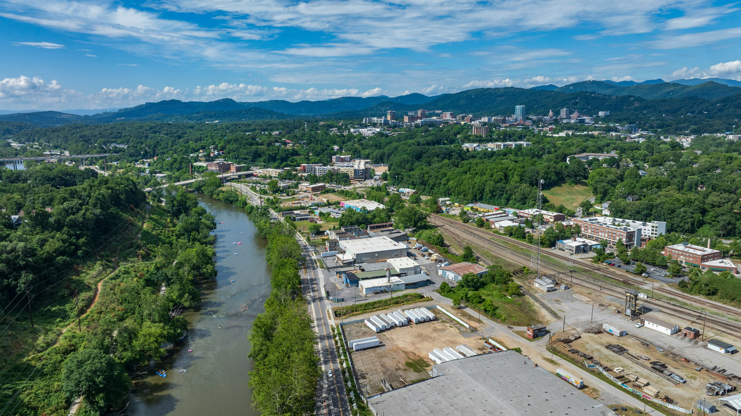 Aerial view of the French Broad River winding through Asheville, North Carolina