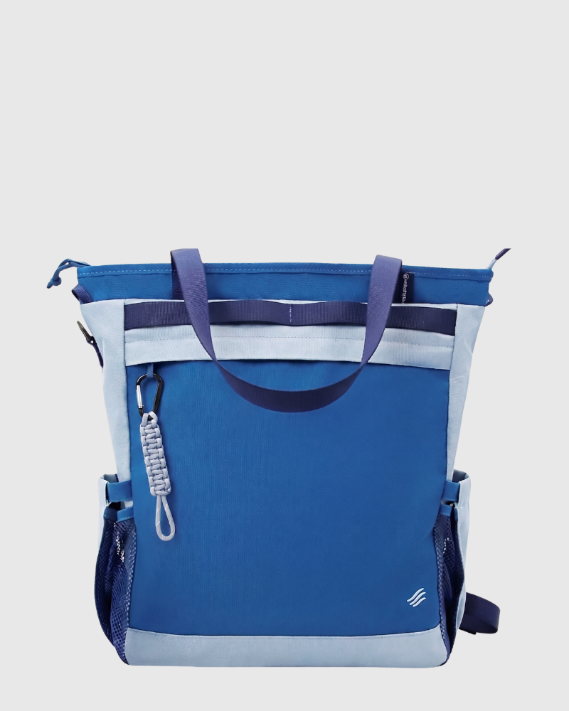 Navy (R)evolution™ 25L Convertible Carryall (Back): Blue tote bag with light blue panels, carabiner zipper pull, mesh side pockets