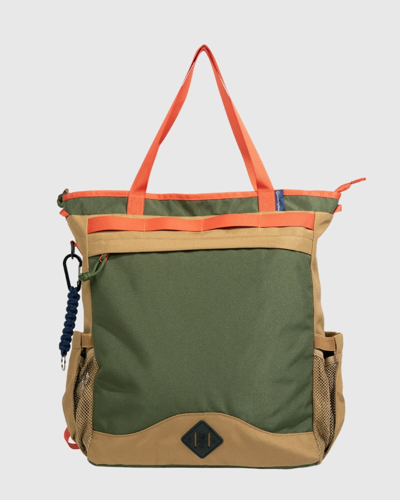 An olive and beige convertible carryall bag with orange straps and multiple pockets, designed to be versatile for work, travel, and school.