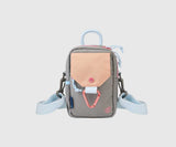 Lt Grey (R)evolution Daily Cross Body (Front): Grey crossbody bag with peach snap-flap pocket, pink carabiner, blue rope handle, chevron strap