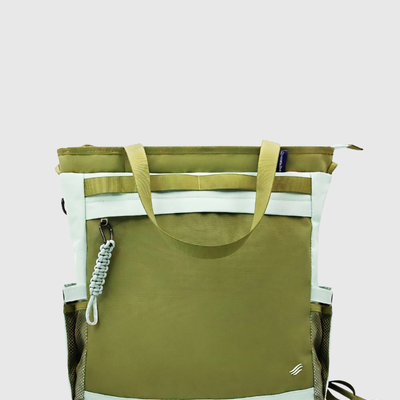 Green Multi (R)evolution™ 25L Convertible Carryall (Front): Olive green tote with mint accents, paracord clip, and mesh side pockets