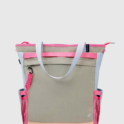 Gray Multi (R)evolution™ 25L Convertible Carryall (Front): Khaki tote with pink straps, light blue side panels, and mesh pockets
