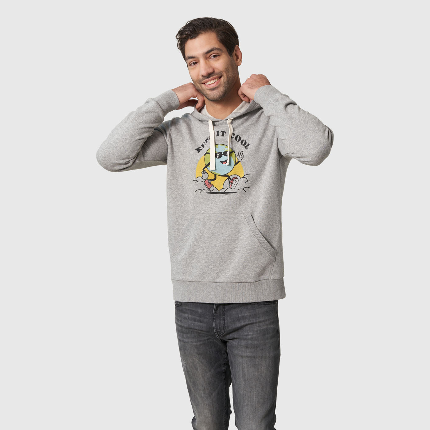 Heather Grey Keep It Cool Dude Graphic Hoodie (In-use): Smiling man wearing grey hoodie with 'Keep It Cool' globe graphic, hands raised