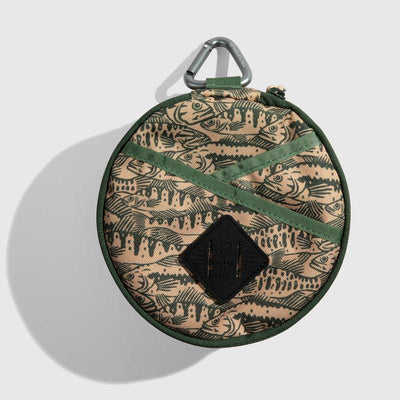 Cortado The Meal Kit (Single) (Front): Round tan pouch with fish print, green straps, carabiner clip top