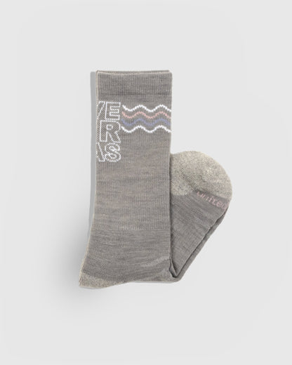 Save Our Seas - Heather Merino Wool - Graphic Crew Sock (Detail): Folded grey crew sock showing knit wave graphic and ribbed cuff
